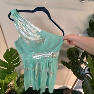 One shoulder teal and silver cocktail dress perfect for wedding guests